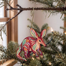 Load image into Gallery viewer, Laser-cut maple wood Aardvark folk art ornament O406 hanging on a fir branch, made in USA
