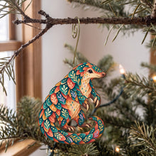 Load image into Gallery viewer, Laser-cut maple wood Ground Pangolin folk art ornament O407 hanging on a fir branch, made in USA