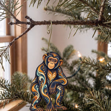Load image into Gallery viewer, Laser-cut maple wood Bonobo folk art ornament O418 hanging on a fir branch, made in USA