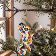 Load image into Gallery viewer, Laser-cut maple wood Sifaka folk art ornament O413 hanging on a fir branch, made in USA
