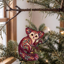 Load image into Gallery viewer, Laser-cut maple wood Aye-Aye folk art ornament O414 hanging on a fir branch, made in USA
