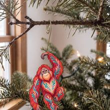 Load image into Gallery viewer, Laser-cut maple wood Orangutan folk art ornament O416 hanging on a fir branch, made in USA
