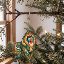 Load image into Gallery viewer, Laser-cut maple wood Mandrill folk art ornament O419 hanging on a fir branch, made in USA
