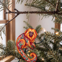 Load image into Gallery viewer, Laser-cut maple wood Golden Lion Tamarin folk art ornament O422 hanging on a fir branch, made in USA
